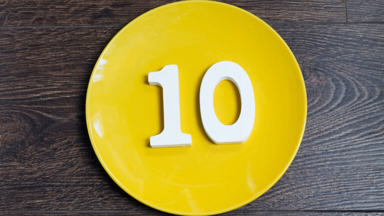 Bright yellow plate with the number 10 for celebrating a milestone or special occasion.