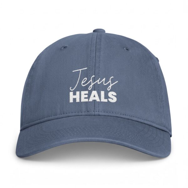 Coastal washed Christian baseball cap with 'Jesus Heals' embroidery.