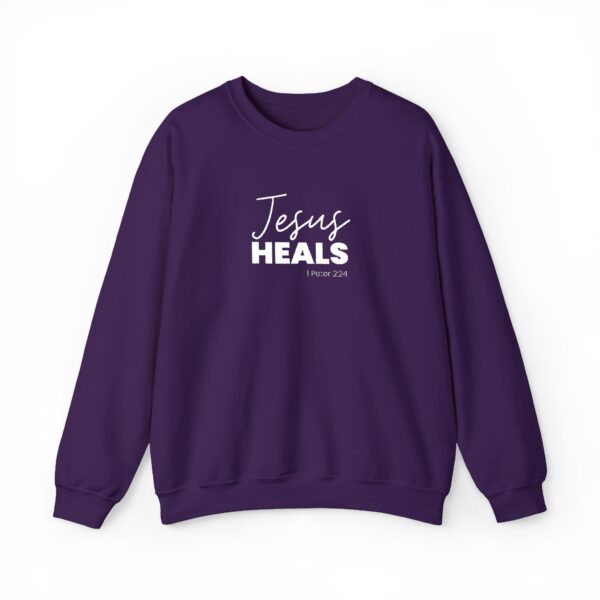 Purple sweatshirt with 'Jesus Heals' and Bible verse 1 Peter 2:24.